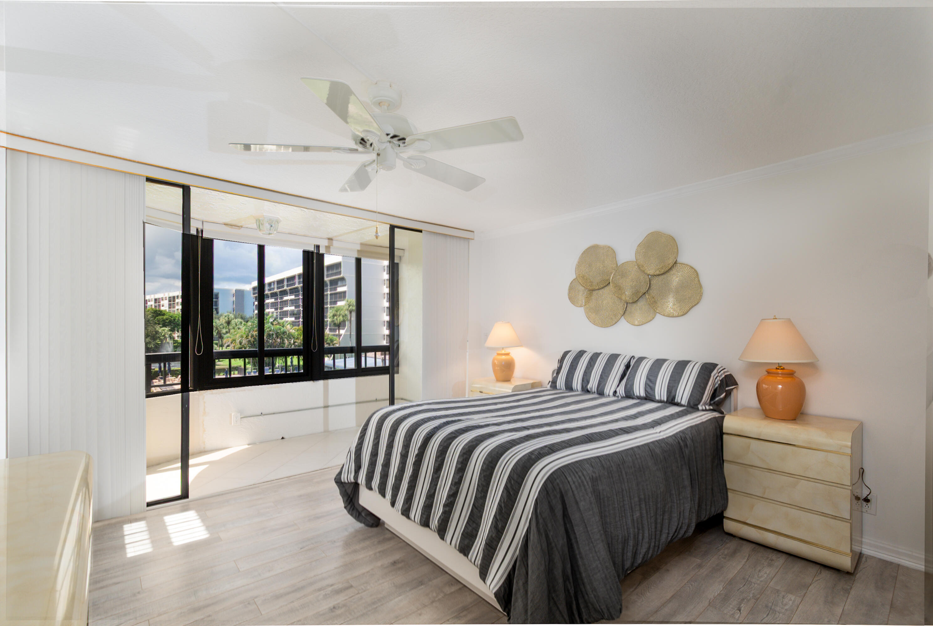 6420 Boca Del Mar Drive, Unit 308 Boca Raton, FL 33433 - Photo 17 of 37 a bedroom with a bed and a large window