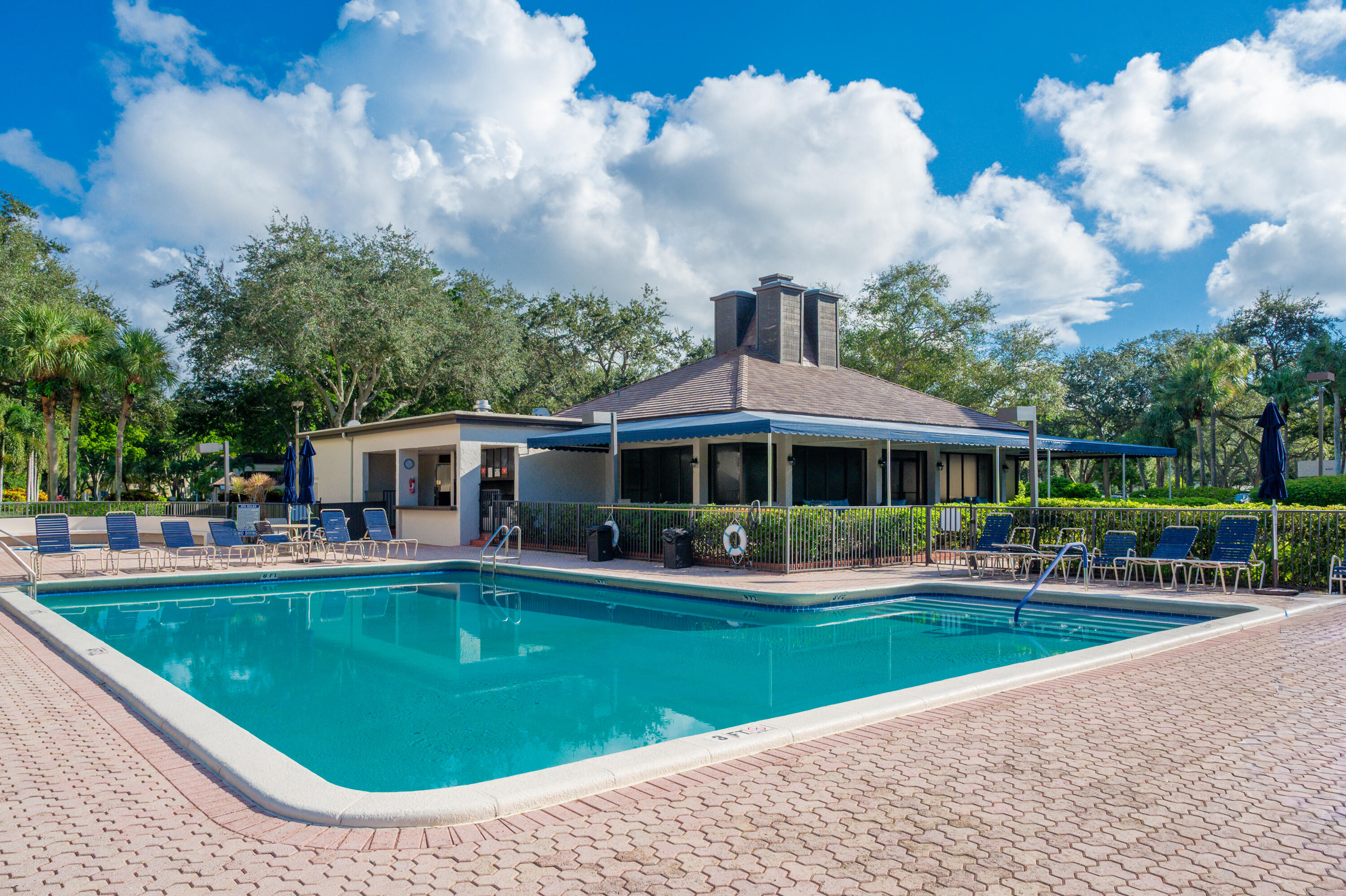 6420 Boca Del Mar Drive, Unit 308 Boca Raton, FL 33433 - Photo 21 of 37 a view of a house with a swimming pool and sitting area