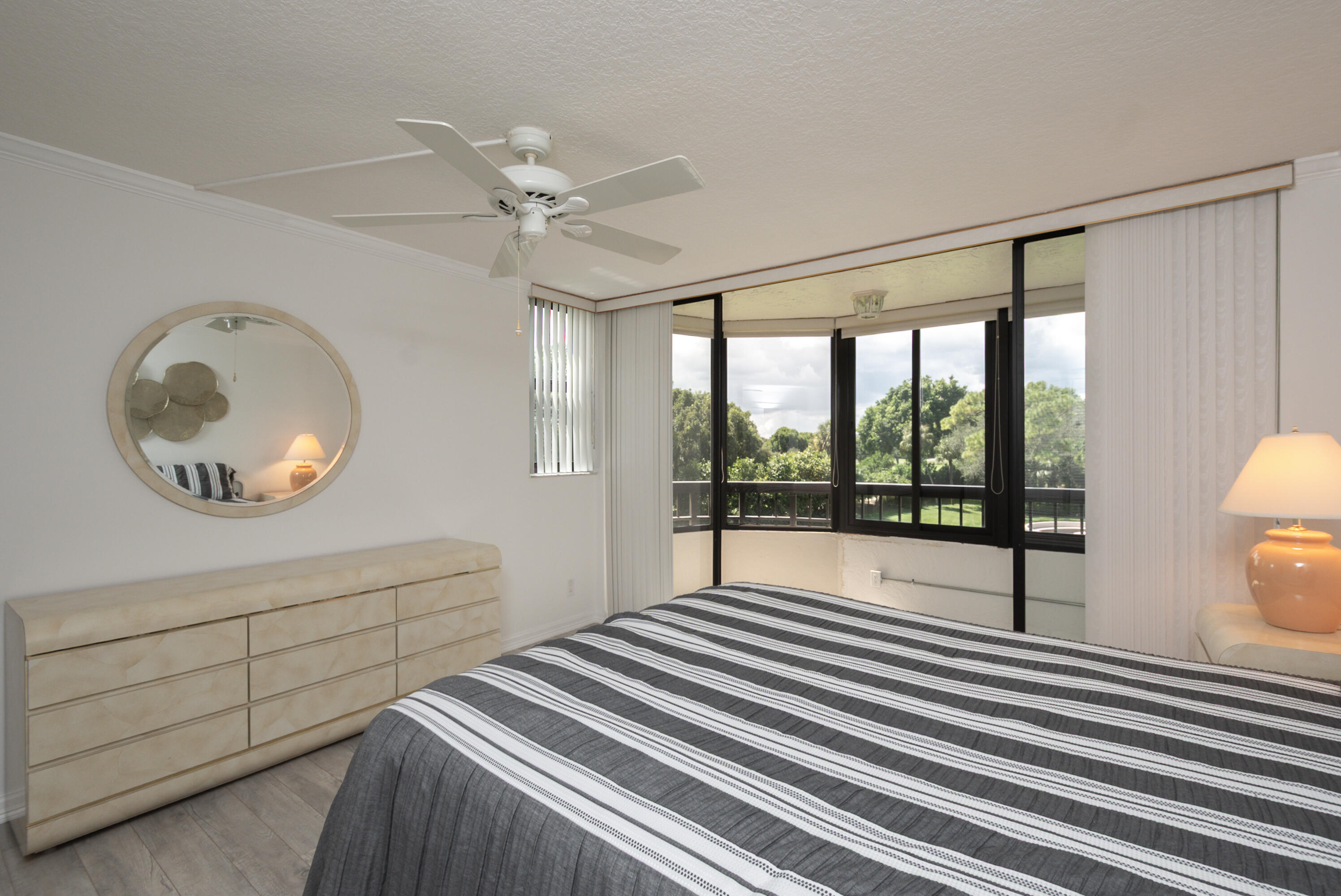 6420 Boca Del Mar Drive, Unit 308 Boca Raton, FL 33433 - Photo 26 of 37 a bedroom with a bed and a large window