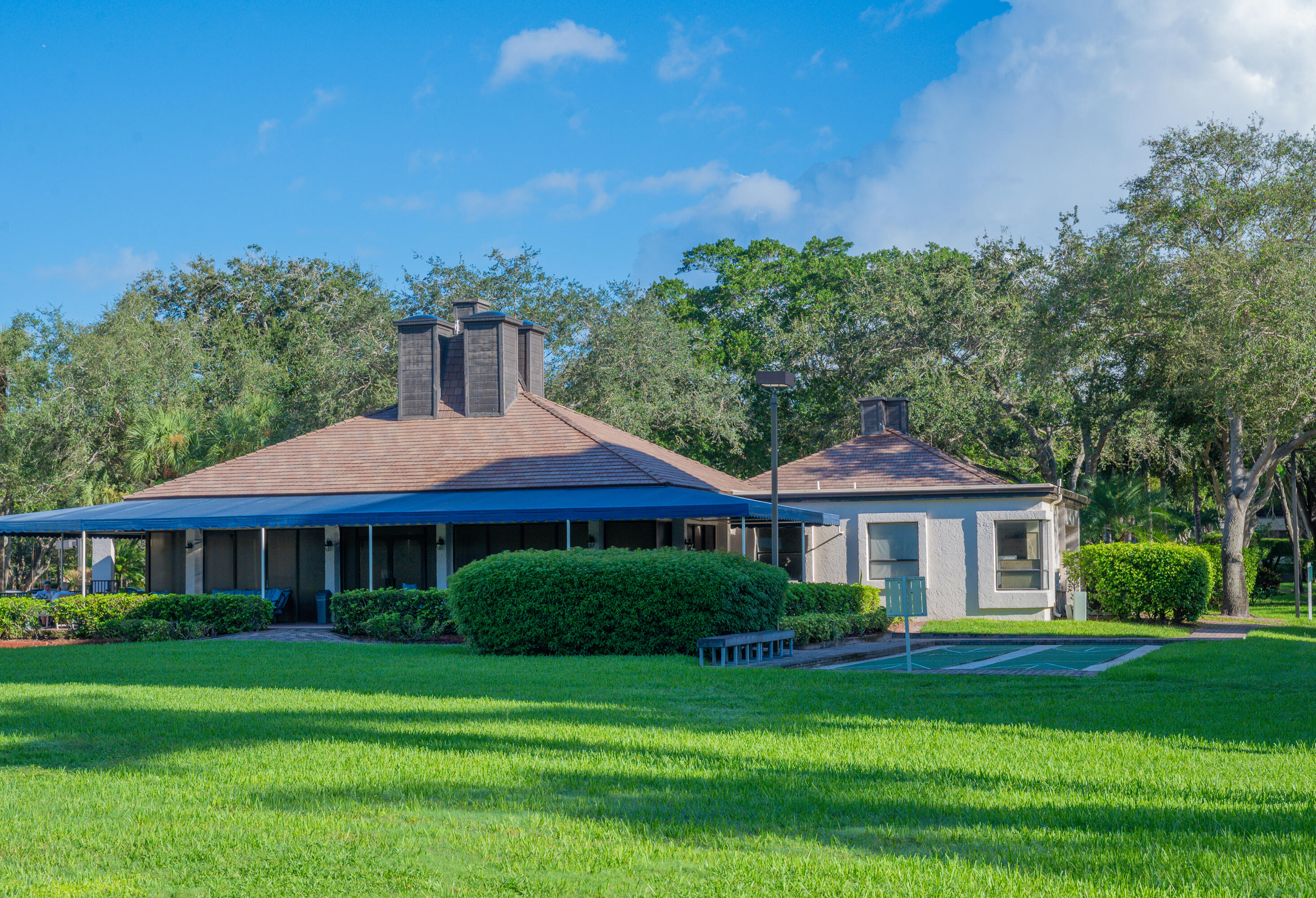 6420 Boca Del Mar Drive, Unit 308 Boca Raton, FL 33433 - Photo 29 of 37 a front view of a house with a garden