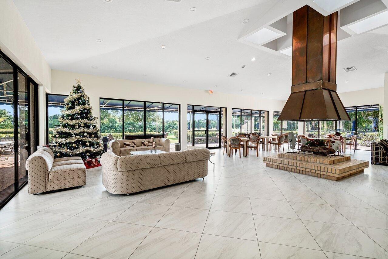 6420 Boca Del Mar Drive, Unit 308 Boca Raton, FL 33433 - Photo 30 of 37 a living room with furniture and a large window