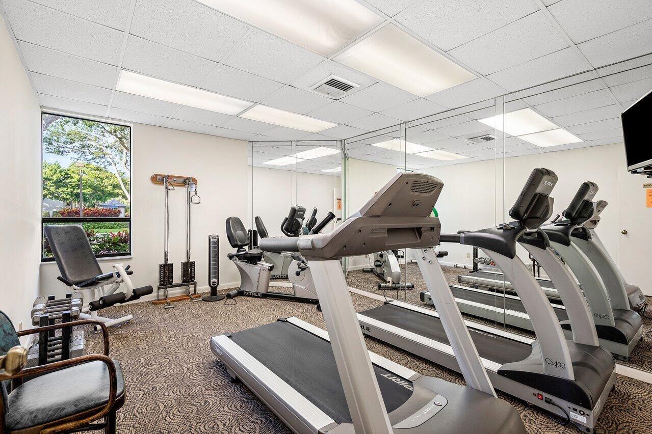6420 Boca Del Mar Drive, Unit 308 Boca Raton, FL 33433 - Photo 33 of 37 a room with gym equipment and windows