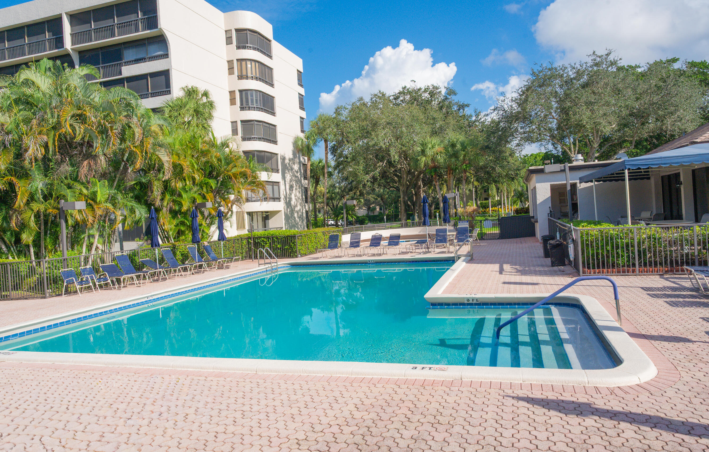 6420 Boca Del Mar Drive, Unit 308 Boca Raton, FL 33433 - Photo 35 of 37 a view of a swimming pool with a patio