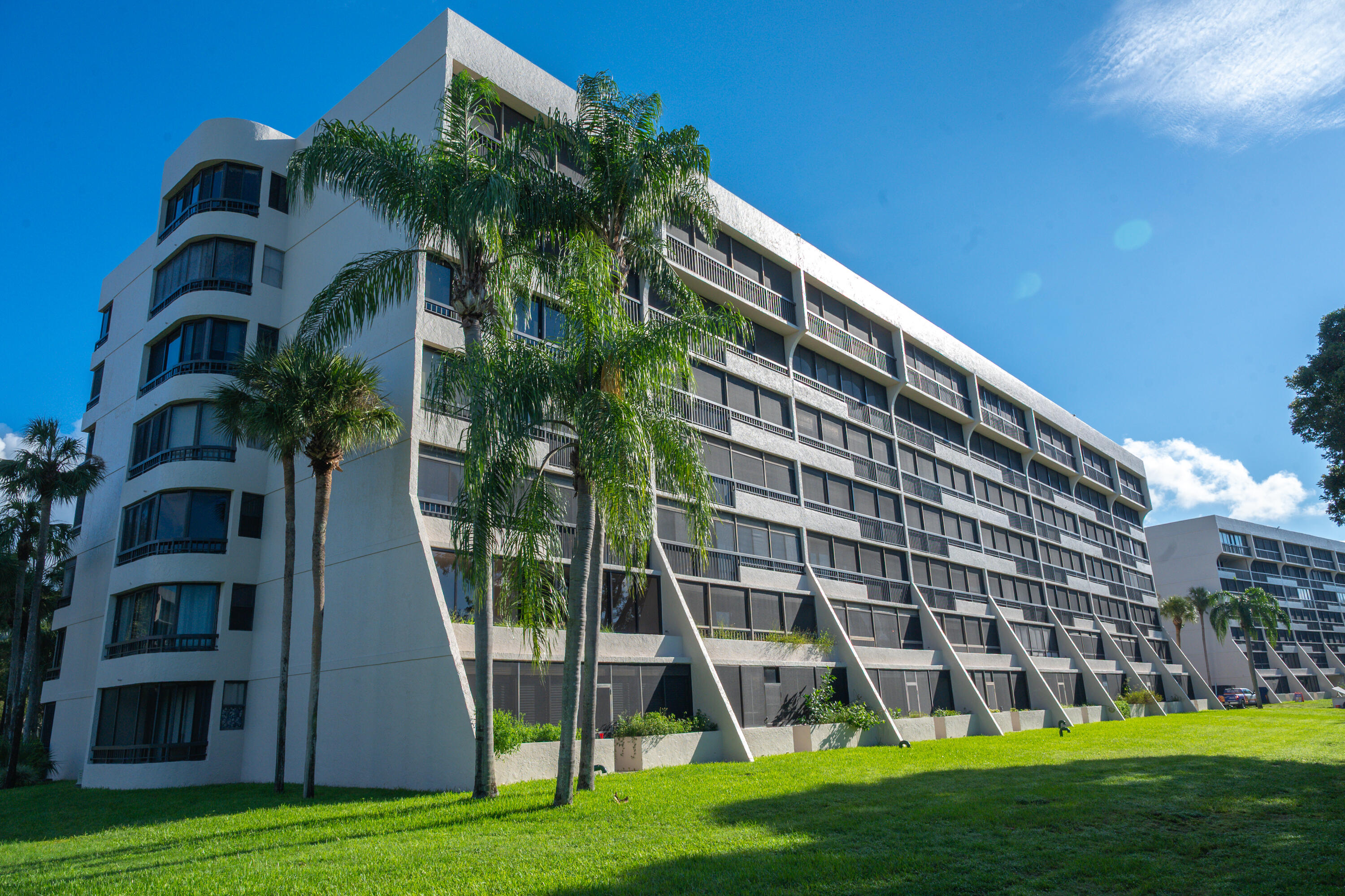 6420 Boca Del Mar Drive, Unit 308 Boca Raton, FL 33433 - Photo 36 of 37 a view of a tall building with a yard