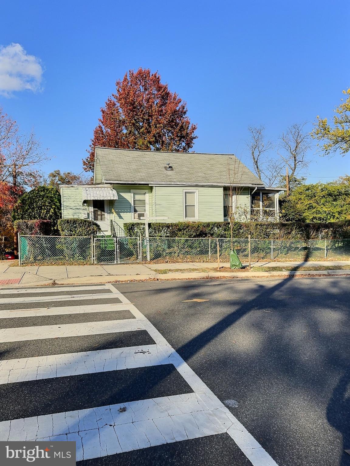 Charming home framed by autumn hues.