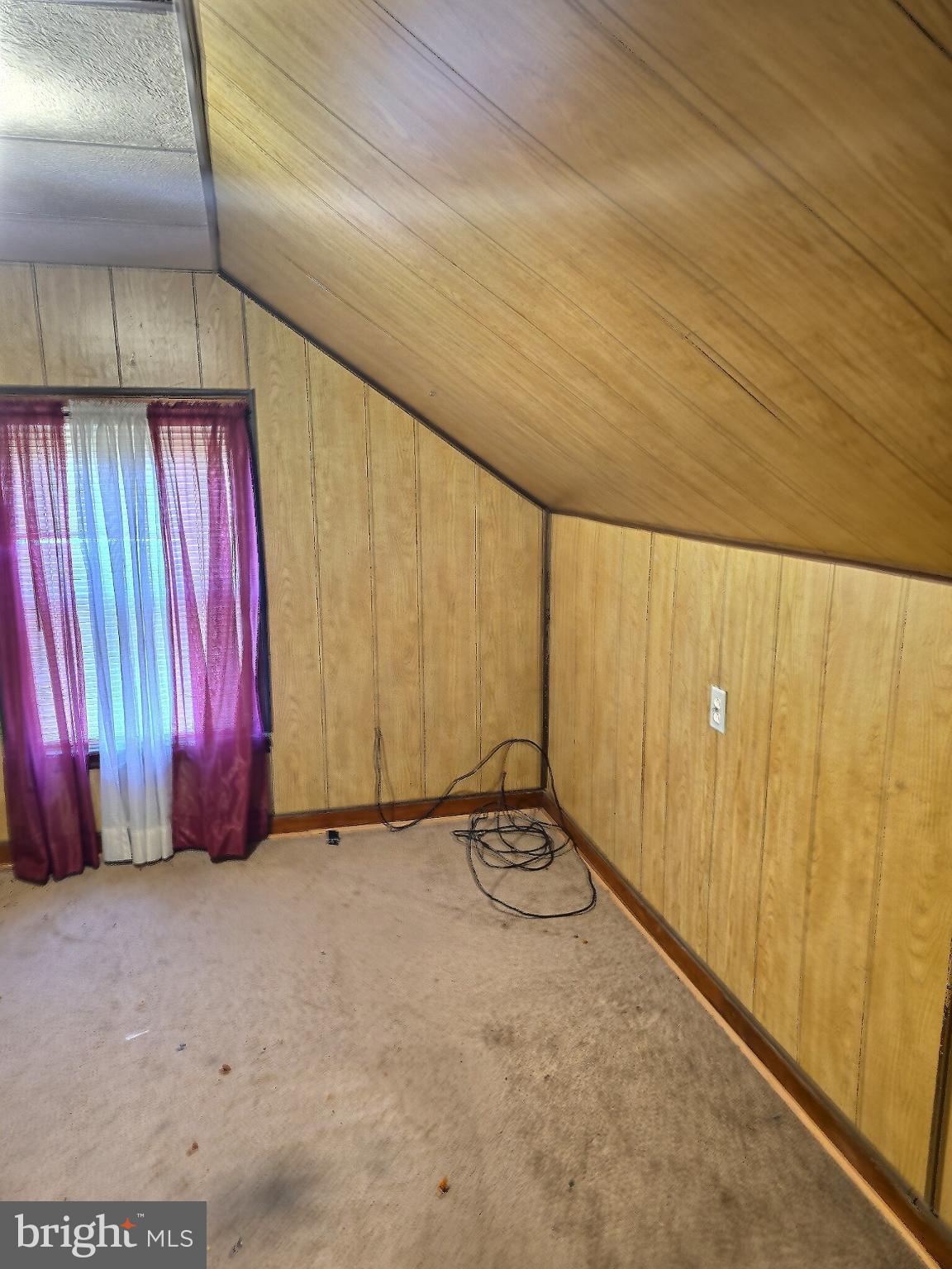 2040 31st Place Southeast Washington, DC 20020 - Photo 14 of 24 Cozy attic space with charming wood paneling.