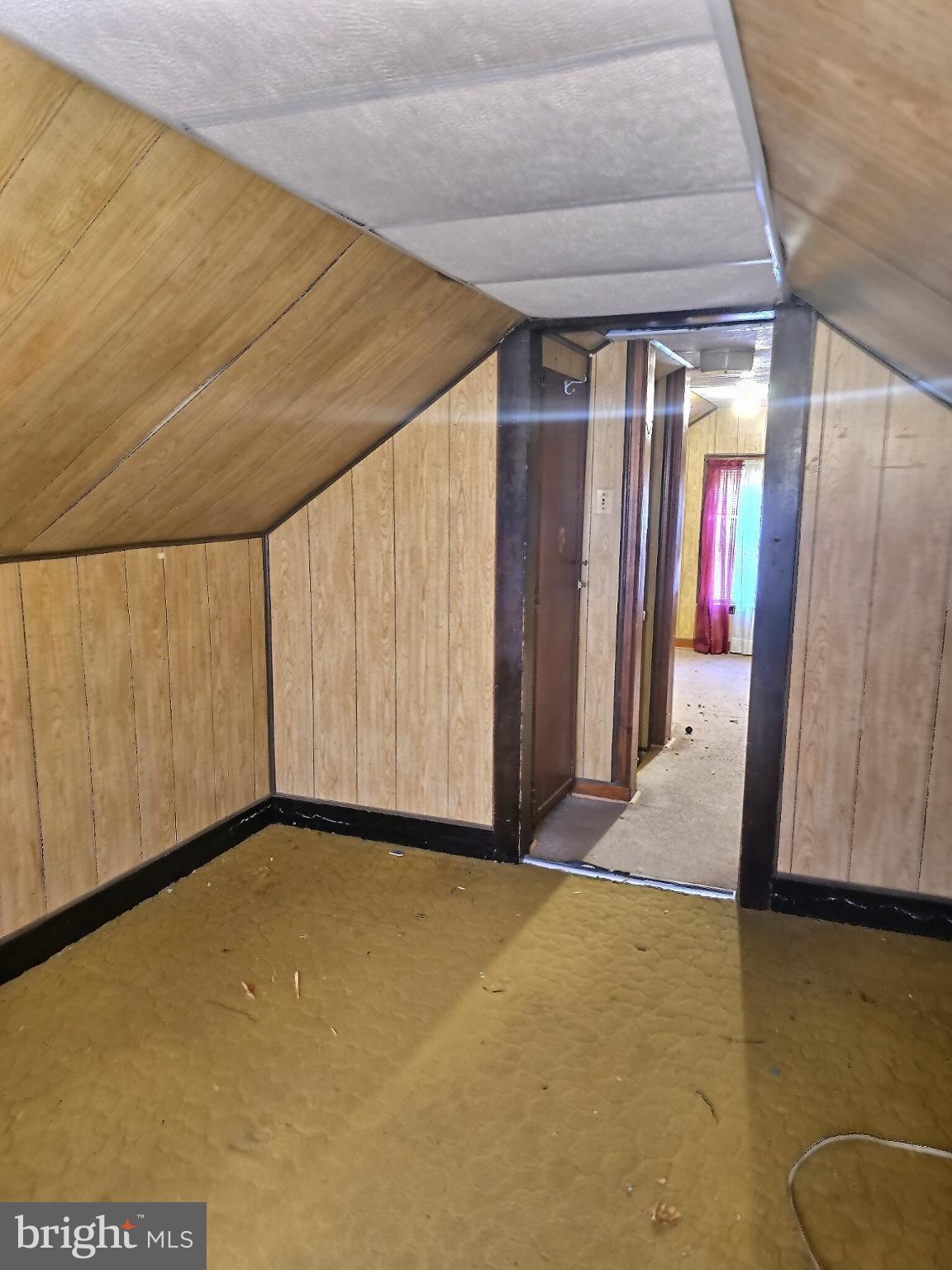 2040 31st Place Southeast Washington, DC 20020 - Photo 15 of 24 Cozy attic space with charming wood paneling.