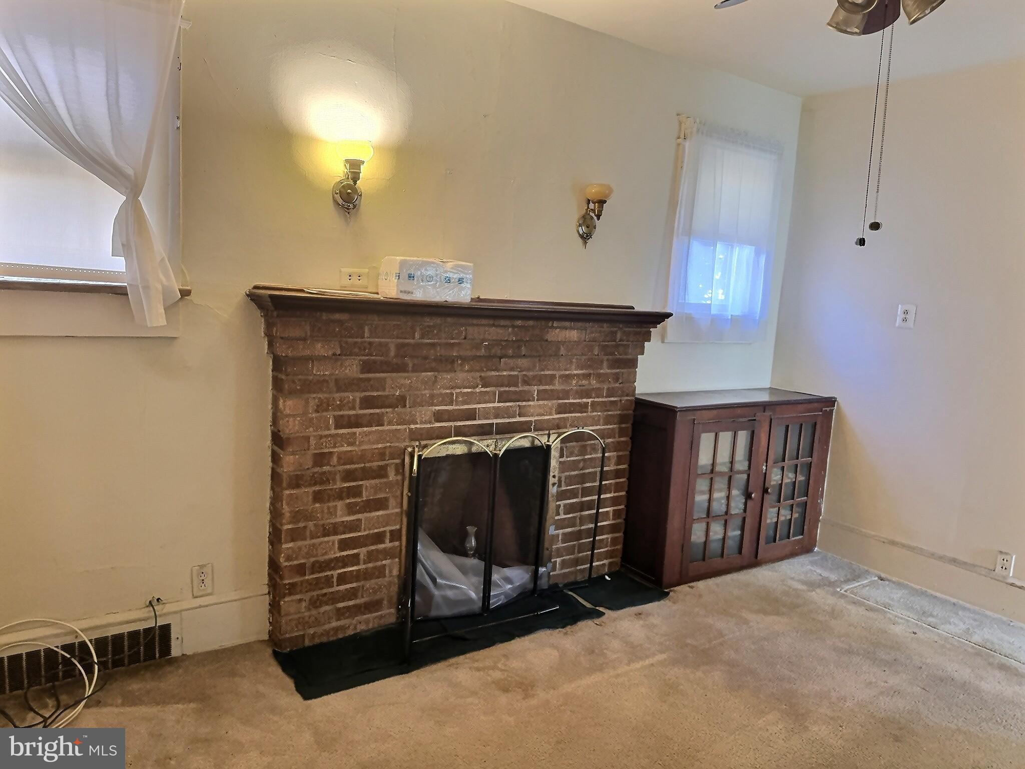 2040 31st Place Southeast Washington, DC 20020 - Photo 7 of 24 Cozy living space with charming fireplace.