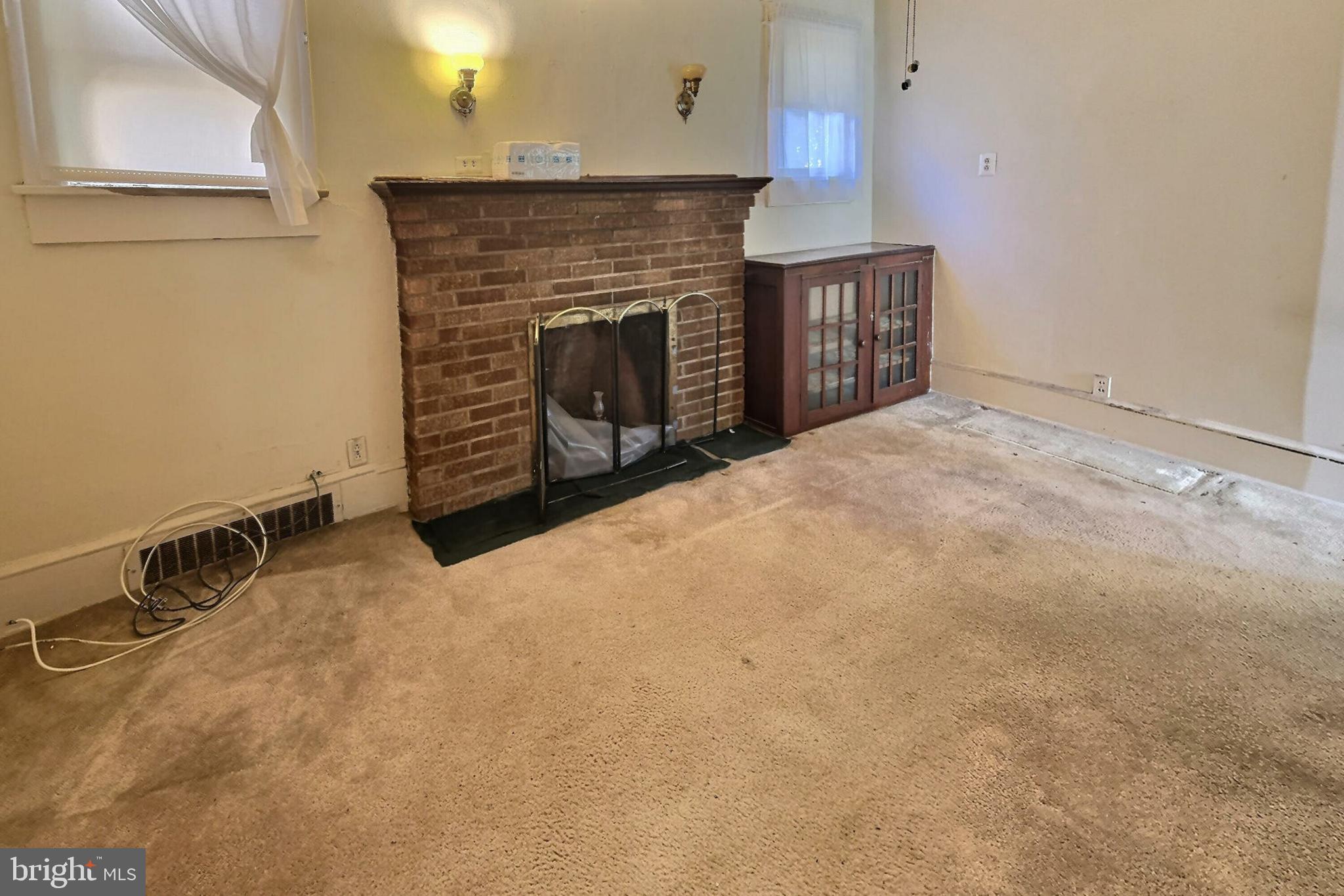 2040 31st Place Southeast Washington, DC 20020 - Photo 8 of 24 Cozy space with charming brick fireplace.