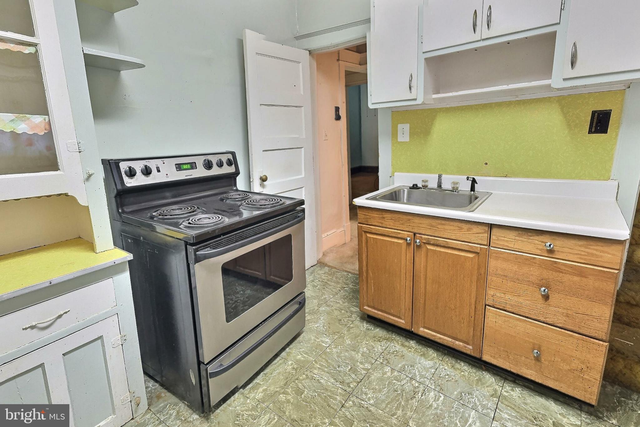 2040 31st Place Southeast Washington, DC 20020 - Photo 9 of 24 Cozy kitchen with vintage charm and modern flair.