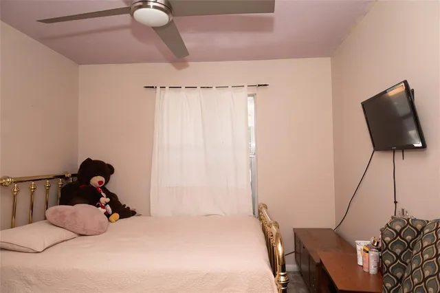 a room with a bed and a chandelier