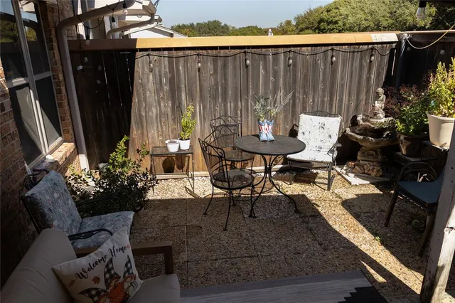 a view of outdoor dining space with a patio and a garden