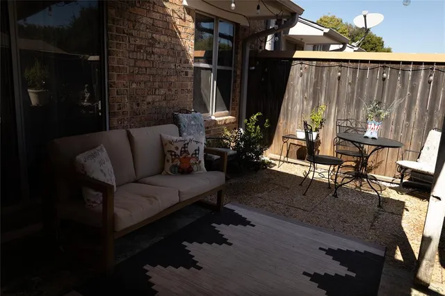 a view of a patio with couple of chairs