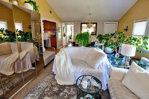 a view of a livingroom with furniture and a table