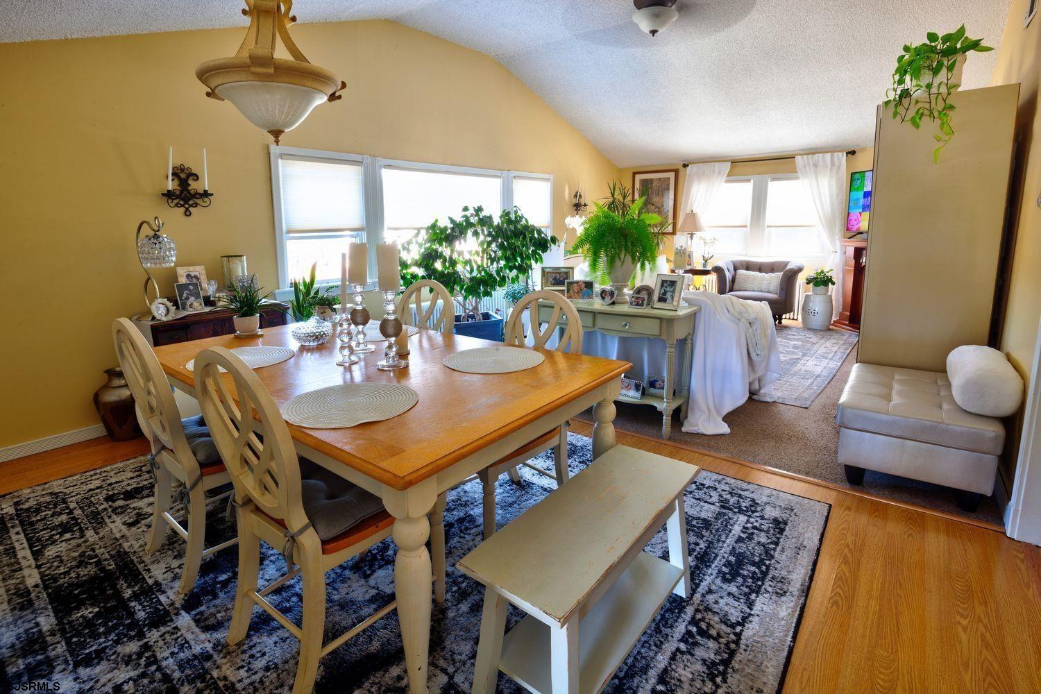14 Lyndhurst Road Marmora, NJ 08223 - Photo 9 of 35 a view of a dining room with furniture and a chandelier