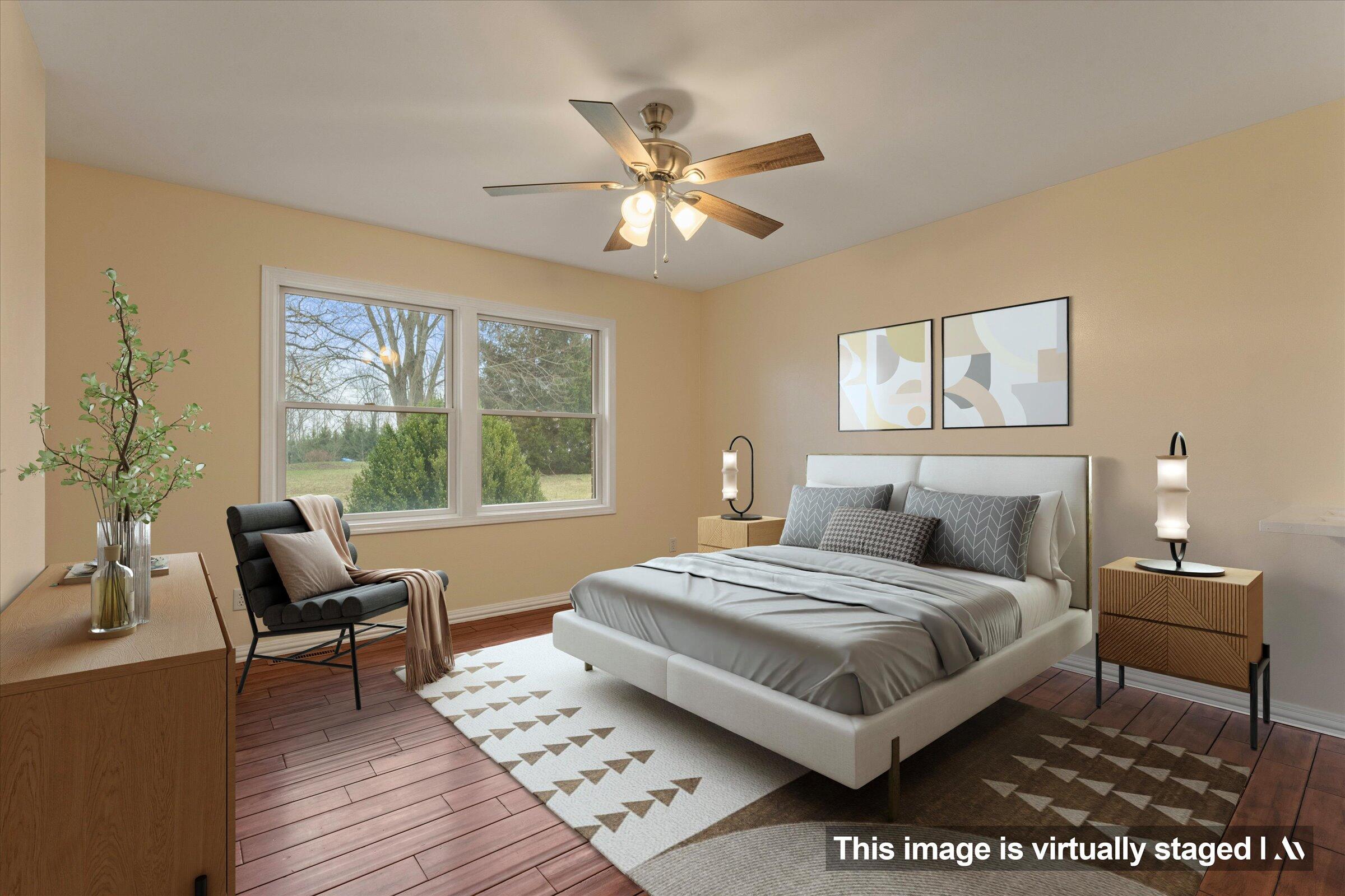 7692 North Emery Road Rolling Prairie, IN 46371 - Photo 21 of 69 a bedroom with a bed and a window