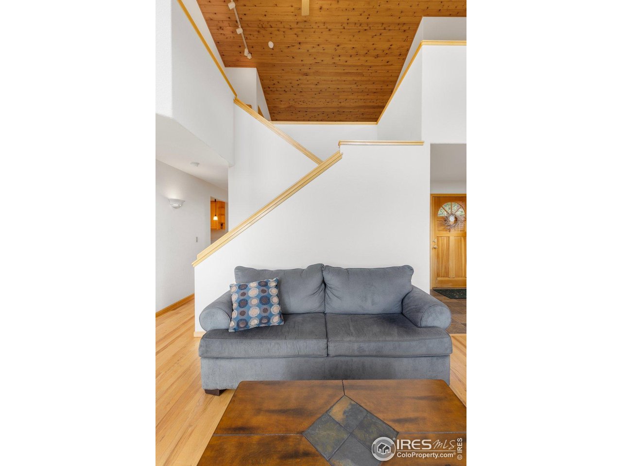 1117 Rock Lake Road Ward, CO 80481 - Photo 15 of 40 Living area with stairwell behind up to loft and primary suite
