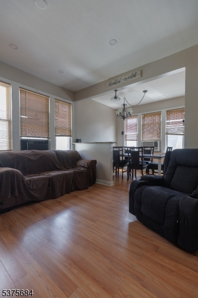 116 West 17th Street Linden, NJ 07036 - Photo 11 of 12 a living room with furniture and a wooden floor