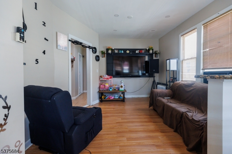 116 West 17th Street Linden, NJ 07036 - Photo 6 of 12 a living room with furniture and a flat screen tv