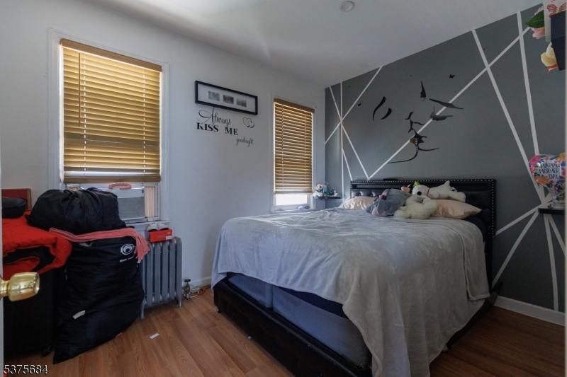 116 West 17th Street Linden, NJ 07036 - Photo 7 of 12 a bedroom with a bed and a window