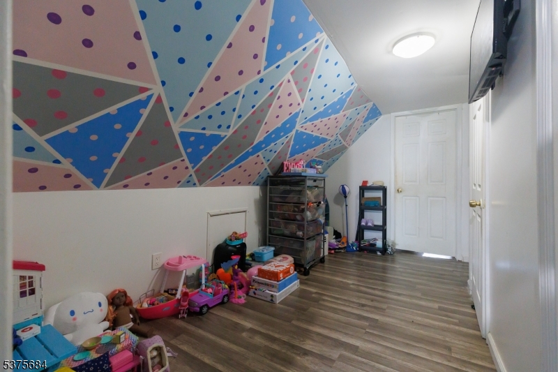 116 West 17th Street Linden, NJ 07036 - Photo 8 of 12 a view of play room with toys and wooden floor
