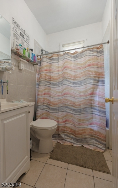 116 West 17th Street Linden, NJ 07036 - Photo 9 of 12 a bathroom with a toilet and a shower