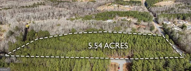 a view of a garden with a building