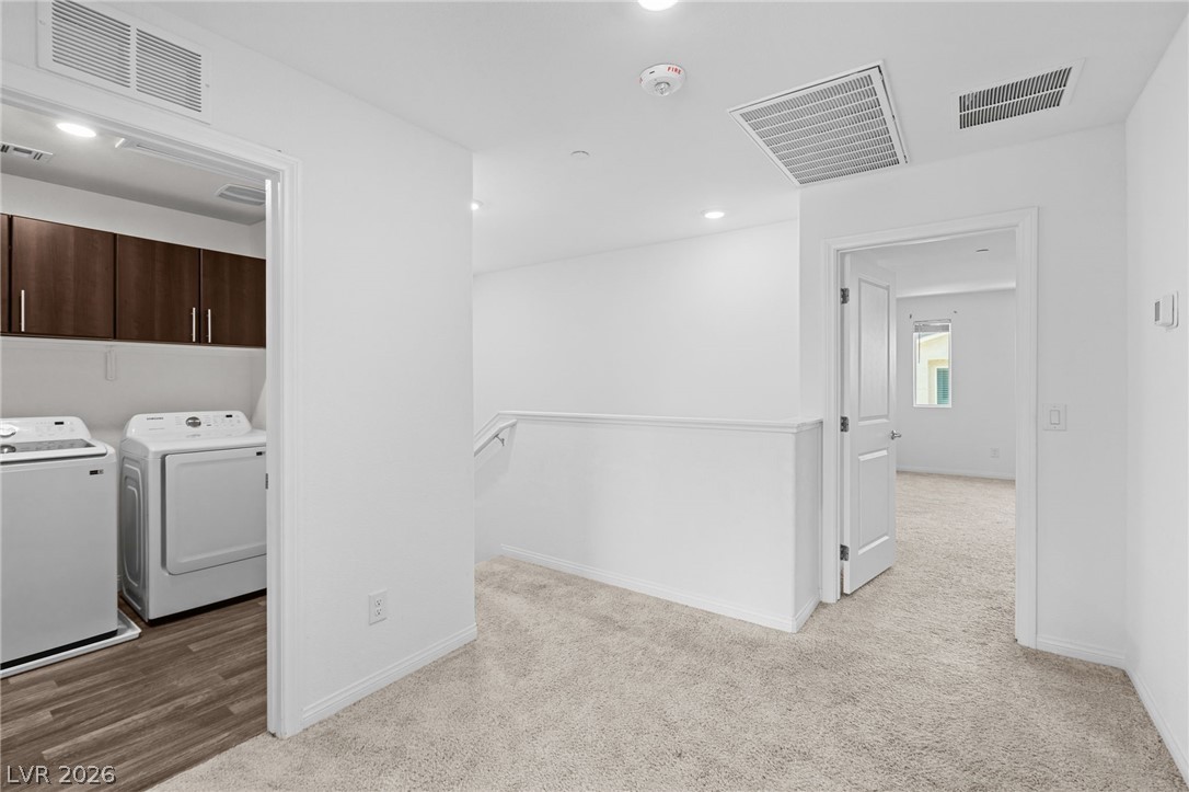 12367 Indigo Montage Road, Unit 3 Las Vegas, NV 89183 - Photo 10 of 33 This dedicated laundry space offers convenience and functional design, complementing the home's comfort.