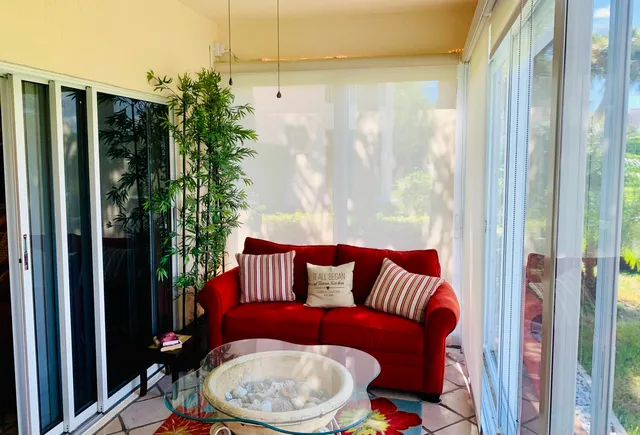 a toilet sitting in a room next to a window