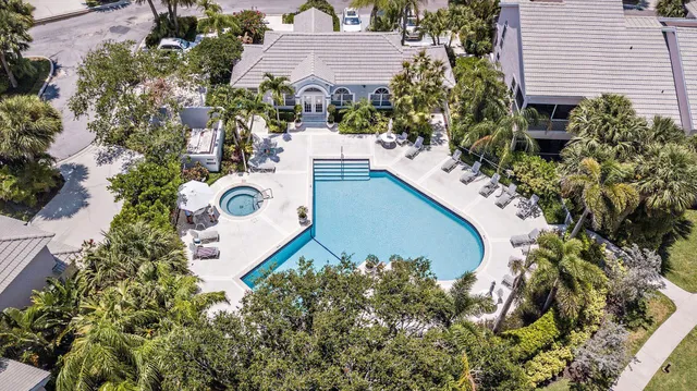 an aerial view of a house with a yard and a garden