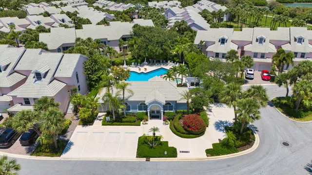 an aerial view of a house with yard swimming pool and outdoor seating