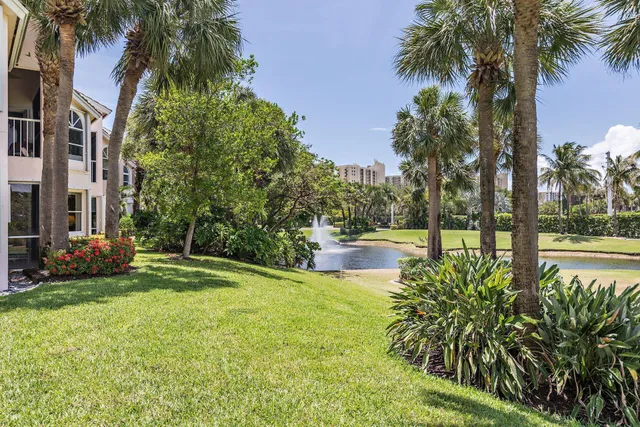 a swimming pool with outdoor seating and yard