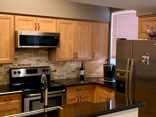 a kitchen with a sink and cabinets