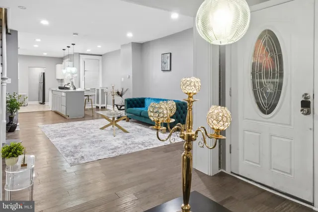 a view of a livingroom with furniture and wooden floor