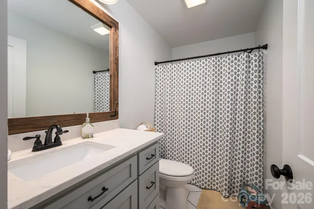 a bedroom with bed and a tv