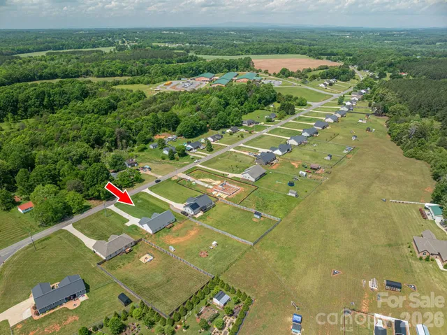 a front view of a house with a yard and pathway
