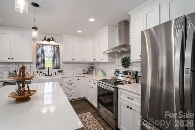 a kitchen with a sink cabinets and window