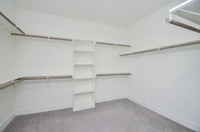 a view of an empty walk in closet