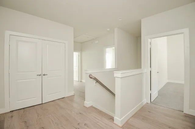 a view of an empty room and wooden floor