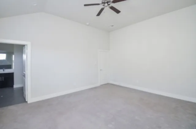 a view of a room with a ceiling fan