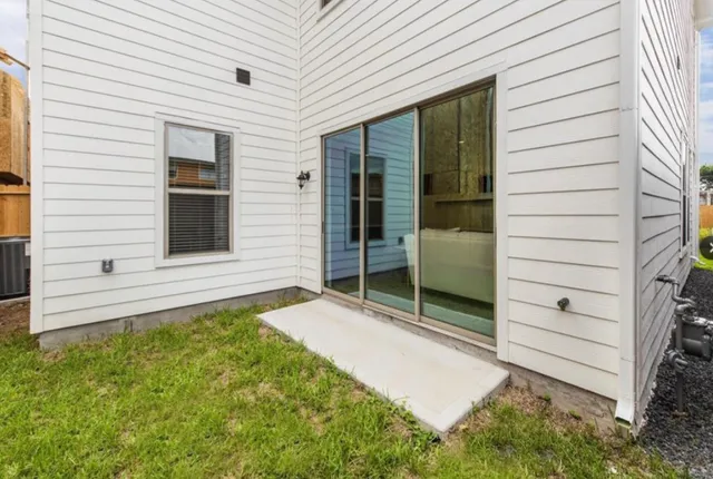 a view of house with backyard