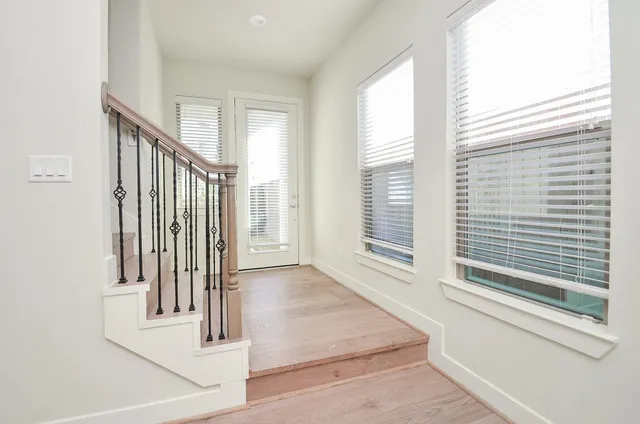 a view of a hallway with windows