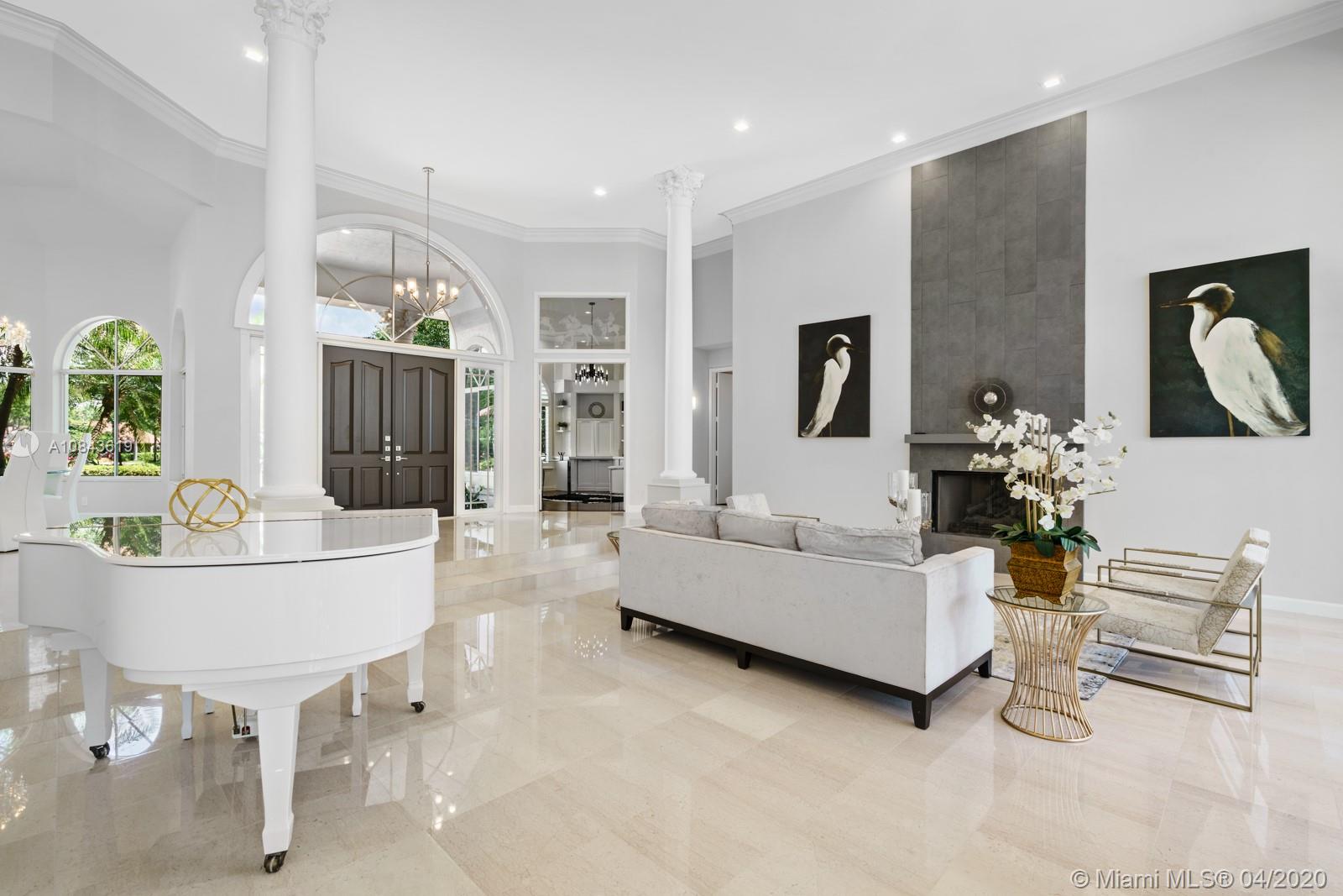 2725 Windmill Ranch Road Weston, FL 33331 - Photo 2 of 42 Glorious Lake view from the moment you enter the home.Grand high ceilings run throughout the entire home.