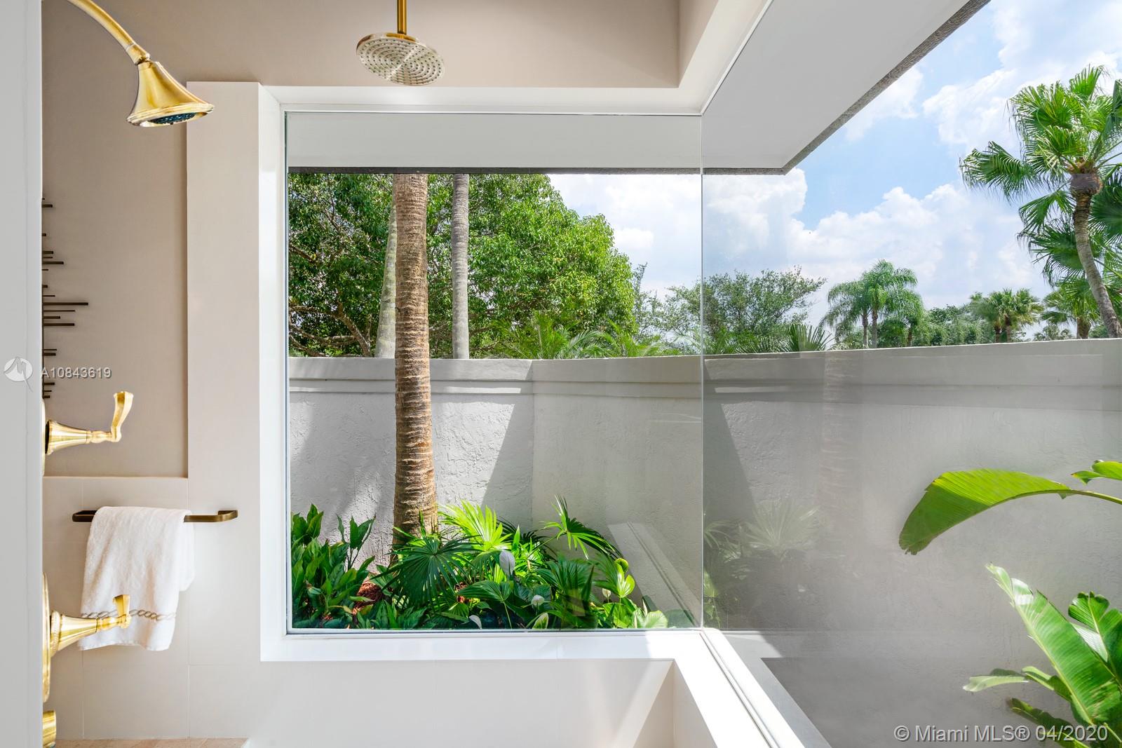 2725 Windmill Ranch Road Weston, FL 33331 - Photo 11 of 42 Master bathroom, glass enclosed shower overlooking tropical paradise.