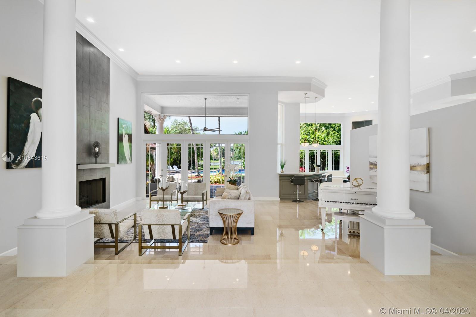 2725 Windmill Ranch Road Weston, FL 33331 - Photo 22 of 42 Formal Living room, with Unique double Lake View. High ceilings, marble floors, Fire places, Large windows, plenty of natural light.
