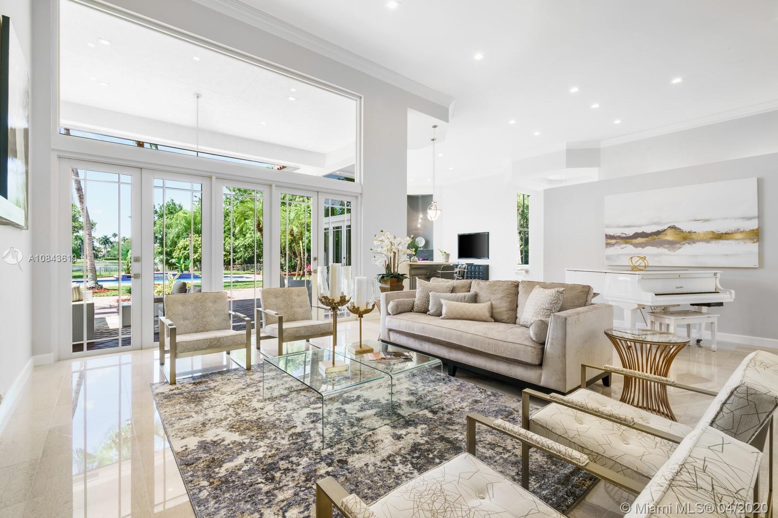 2725 Windmill Ranch Road Weston, FL 33331 - Photo 24 of 42 Formal Living room paired with lavish private outdoor space.