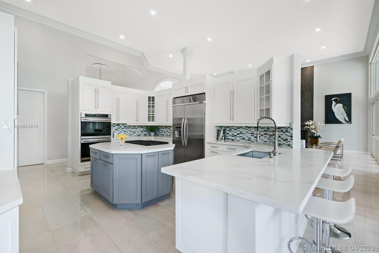 2725 Windmill Ranch Road Weston, FL 33331 - Photo 27 of 42 Open, chefs kitchen, new gas stove top, quartz counter tops, glass back splash, new st/st appliances.