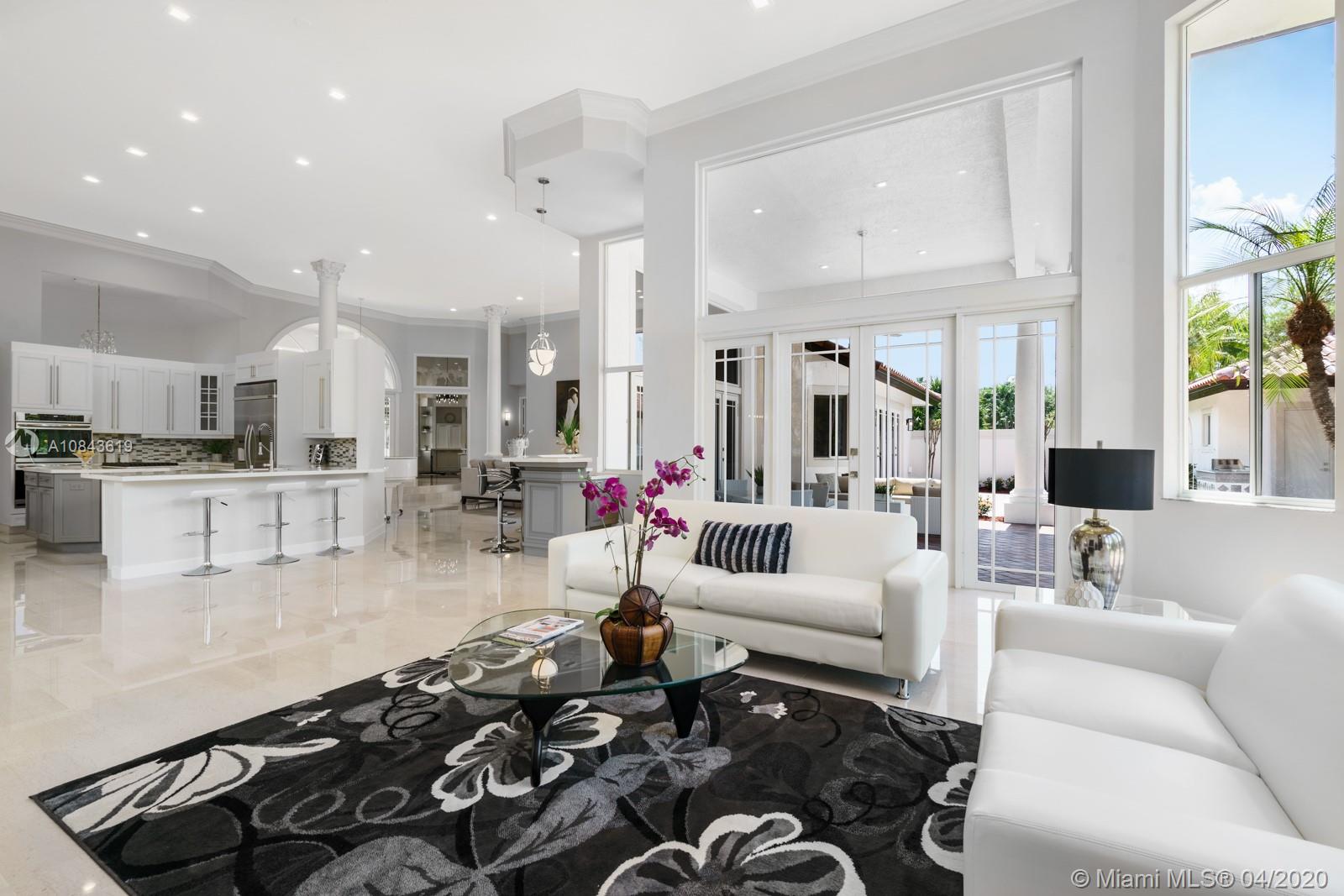 2725 Windmill Ranch Road Weston, FL 33331 - Photo 4 of 42 Open floor plan. Every room of this house is flooded with light thanks to multitude of French doors and windows.Formal living room, family room, kitchen, wet bar all overlooking tropical paradise.