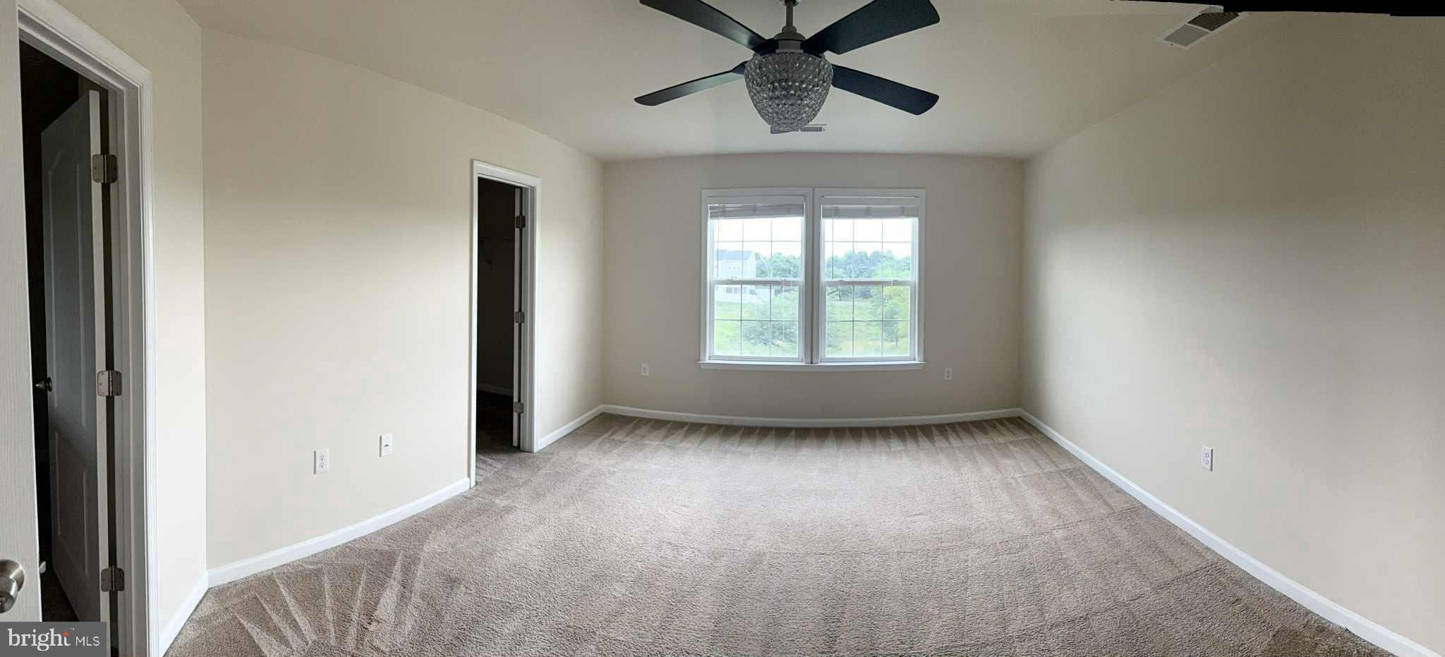 1130 Stallion Street Ranson, WV 25438 - Photo 16 of 24 an empty room with chandelier fan