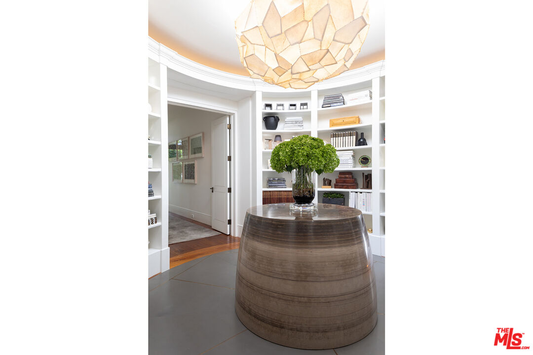 1192 Cabrillo Drive Beverly Hills, CA 90210 - Photo 15 of 43 a room with a large window and potted plants